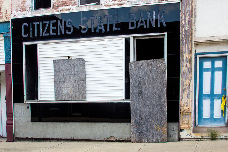 Photo of an abandonded bank storefront.