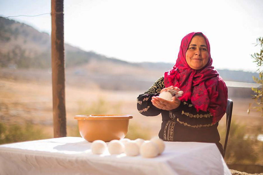 A photograph of a woman preparing food