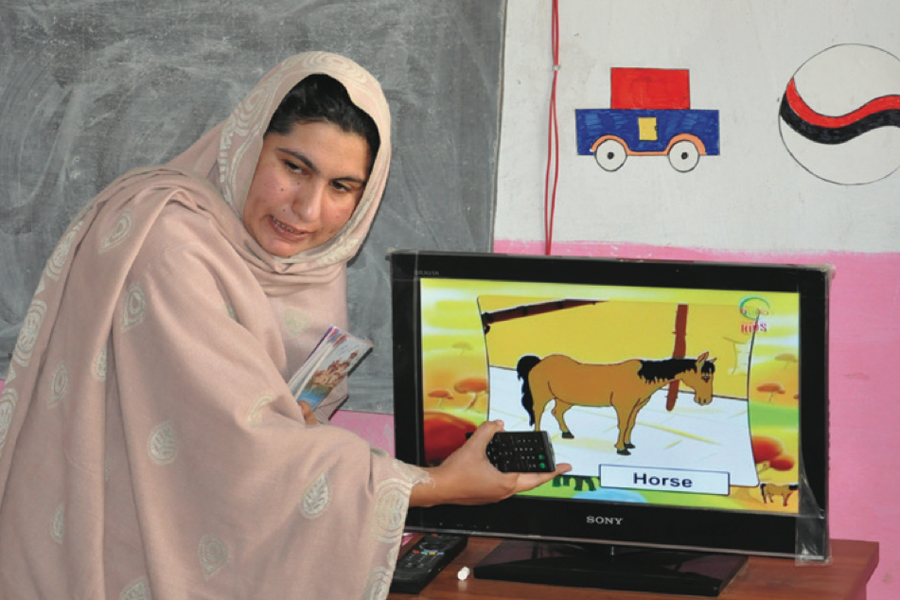 Photo of teacher using visual aids