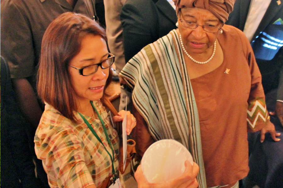 Photograph of Liberian President Ellen Johnson Sirleaf, with Liberia FED Chief of Party Agnes Luz