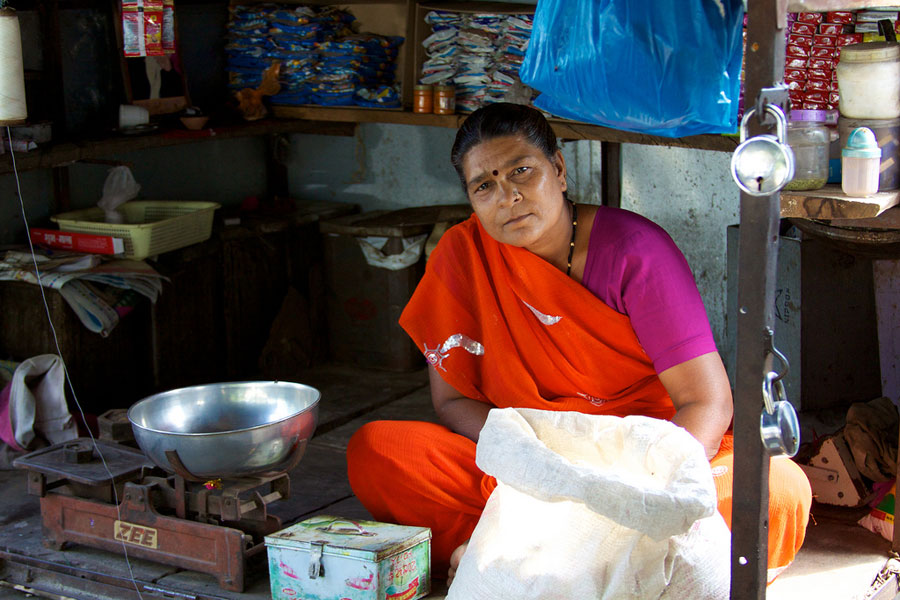 Photo of a woman running a local market.