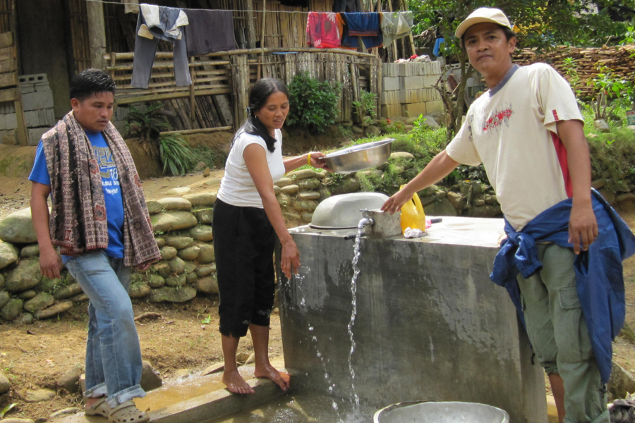 Photograph of Philippine citizens acessing new water connections.